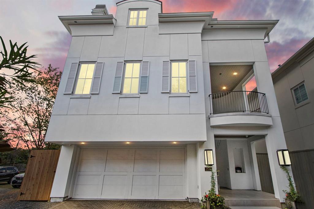 a front view of a house with a garage