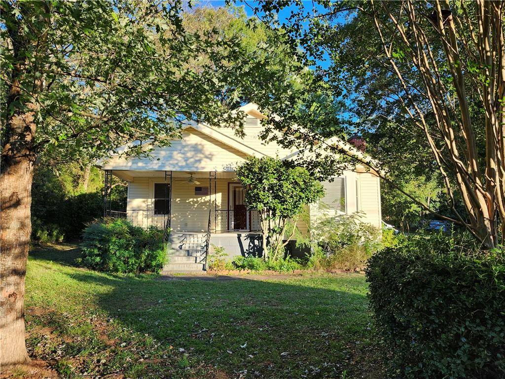 a front view of a house with garden