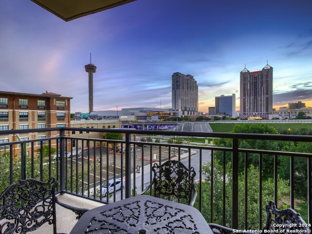 a view of a balcony with city view