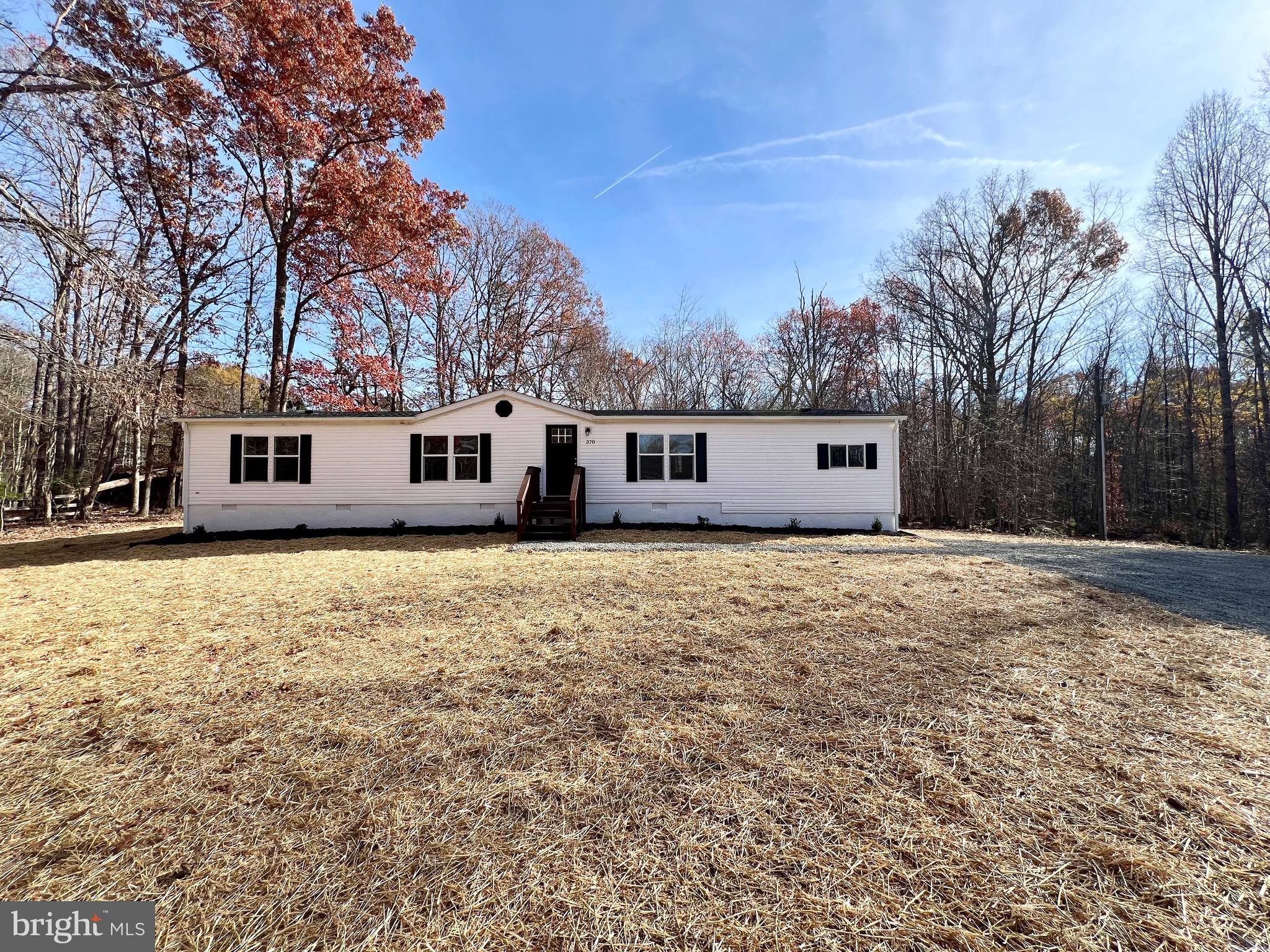 a front view of house with a yard