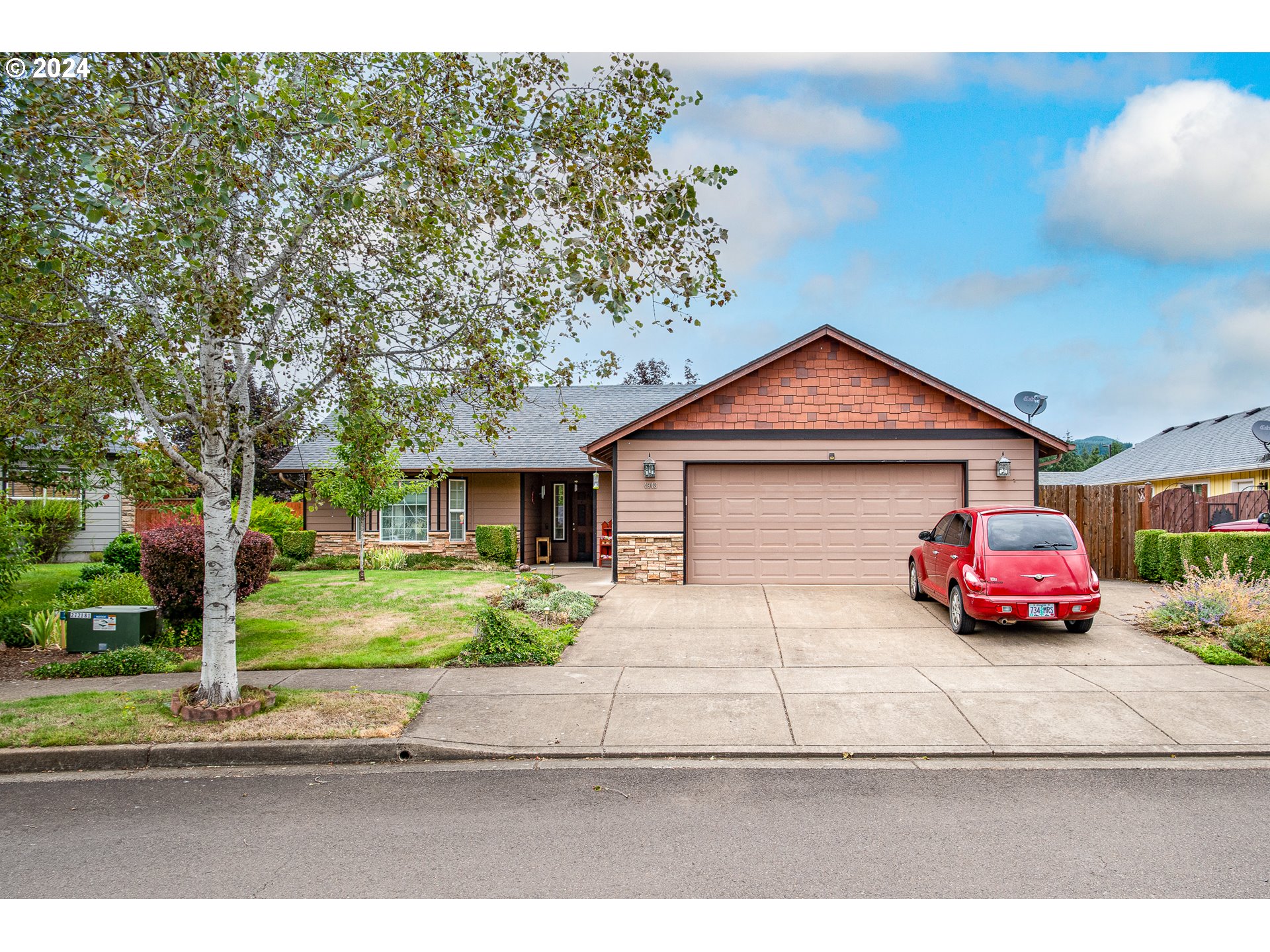 a view of a car in front of a house