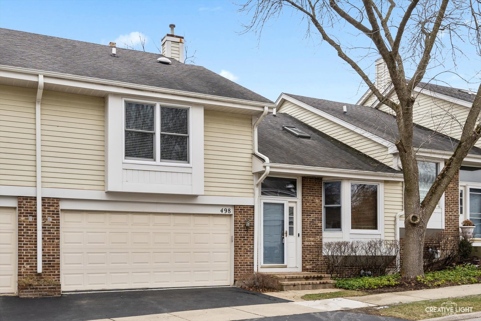 a front view of a house with a yard