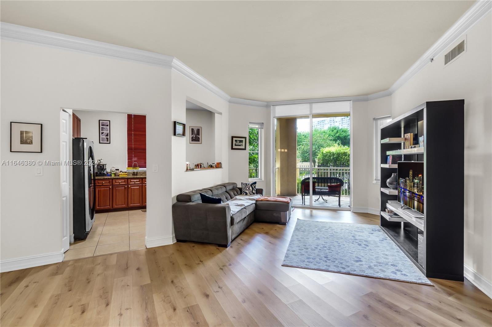 a living room with furniture and a book shelf