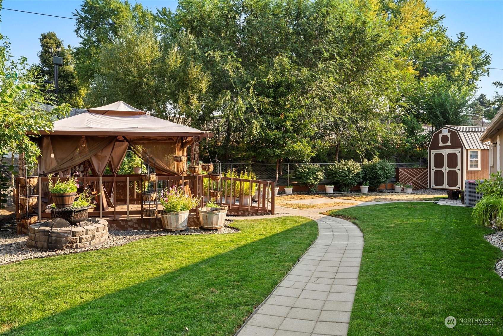 a view of a house with backyard sitting area and garden