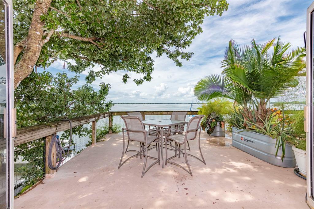 a view of a patio with a table and chairs