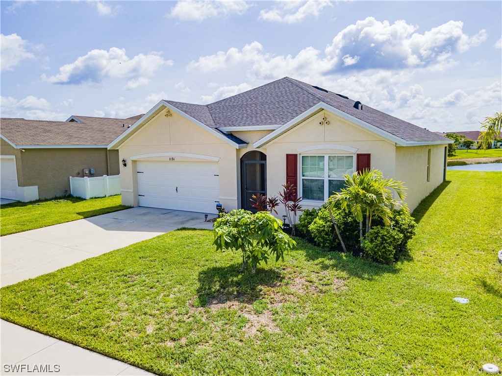 a front view of house with yard and green space