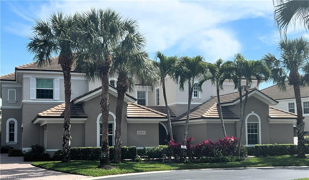 front view of a residential houses with a yard