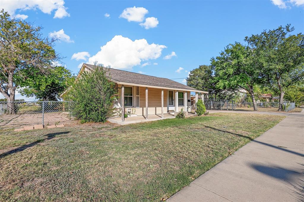 a view of house with outdoor space and garden