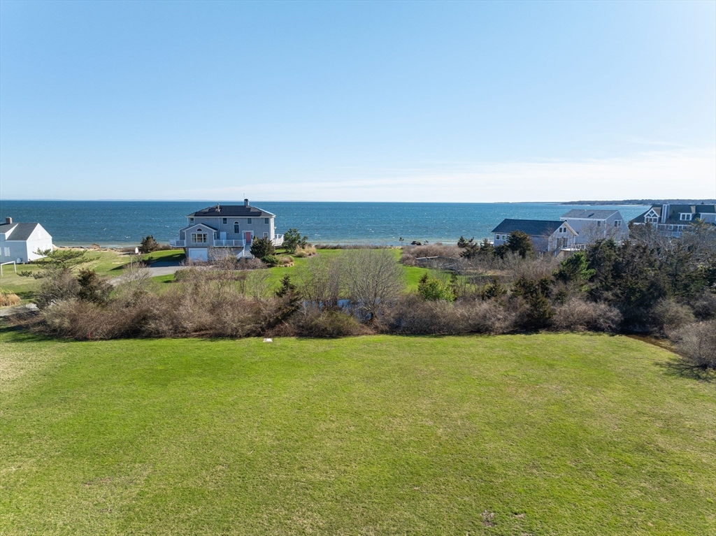 a view of a field with an ocean