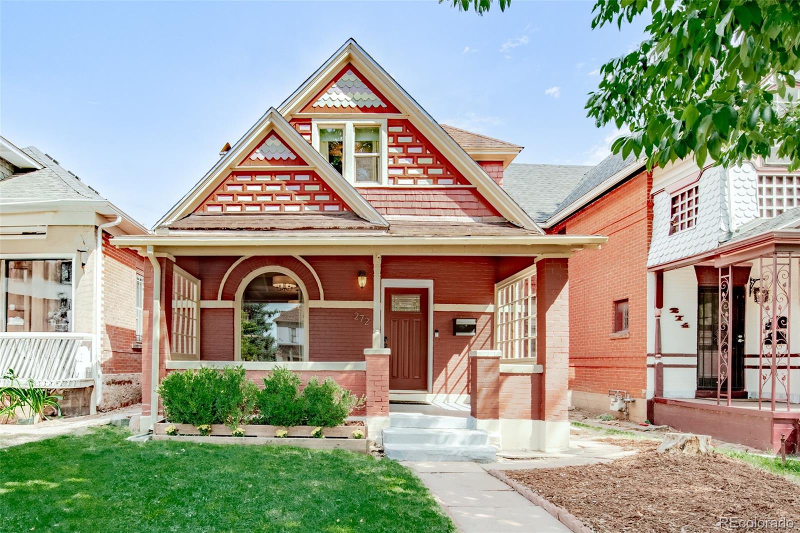 a front view of a house with garden