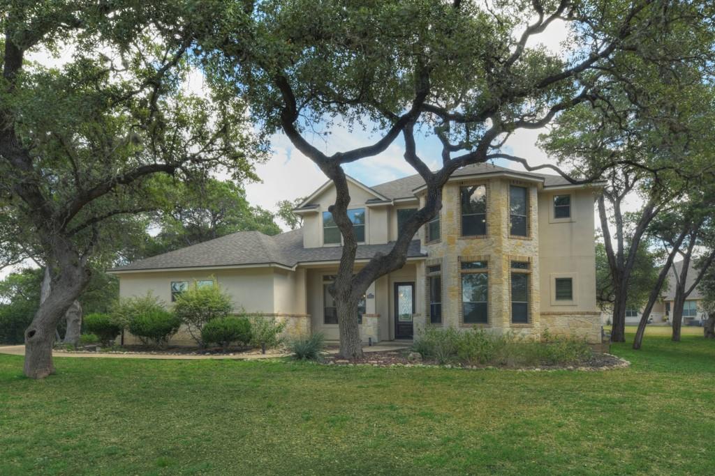 front view of a house with a garden