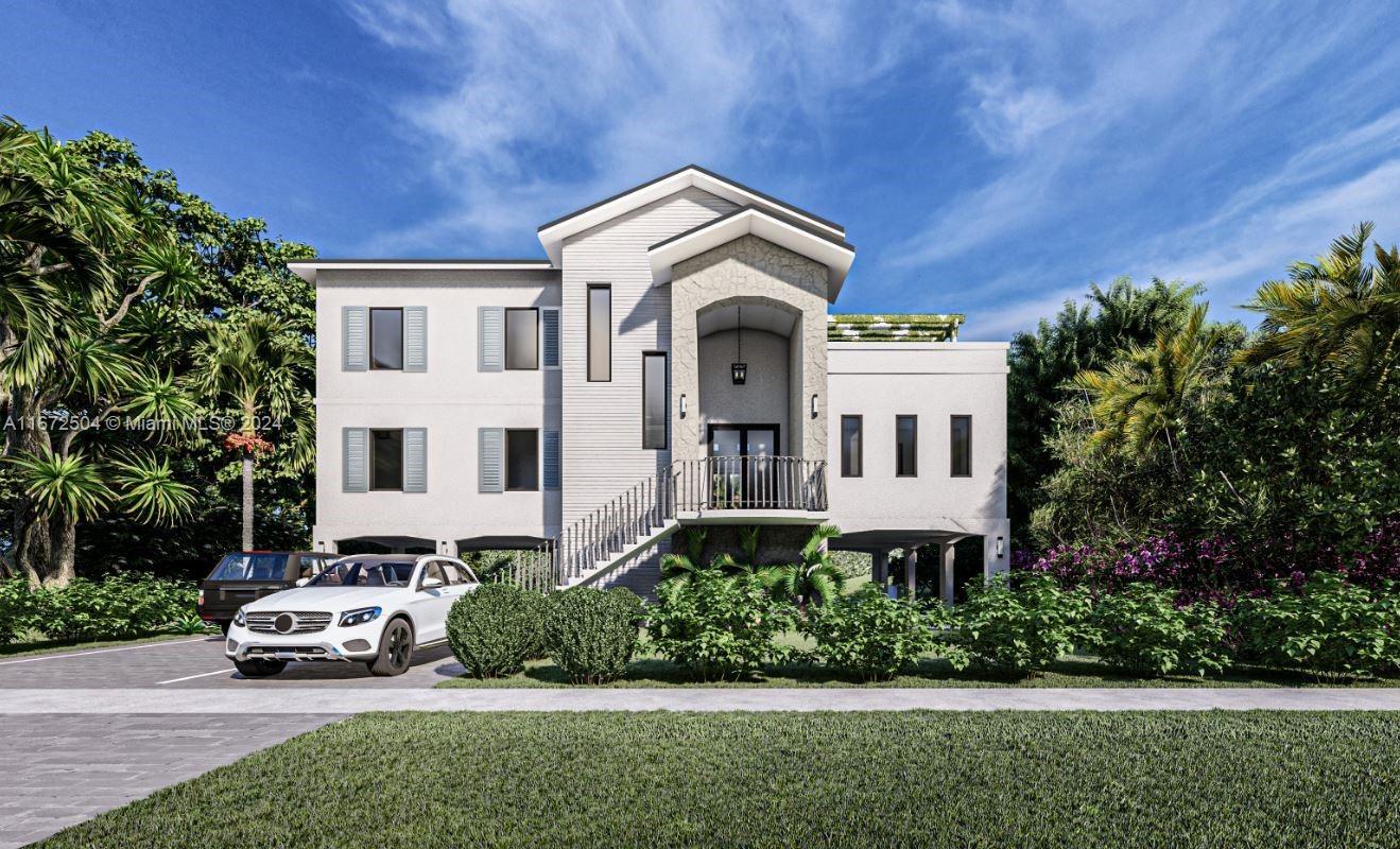 a car parked in front of a house with a garden