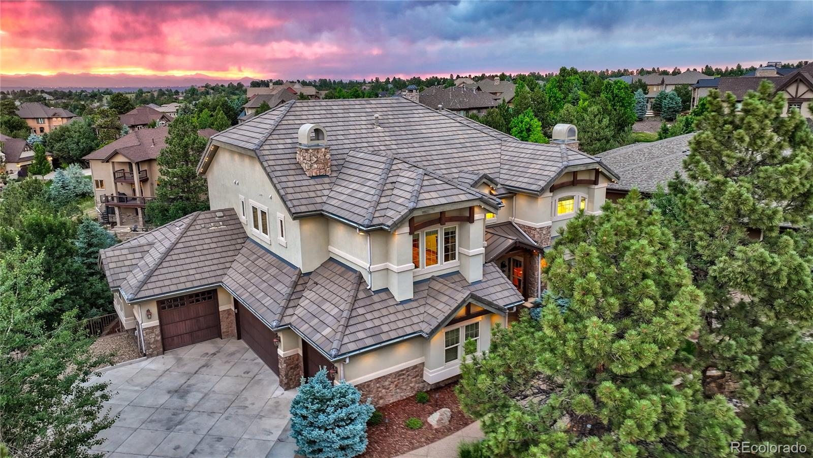 an aerial view of a house with a garden