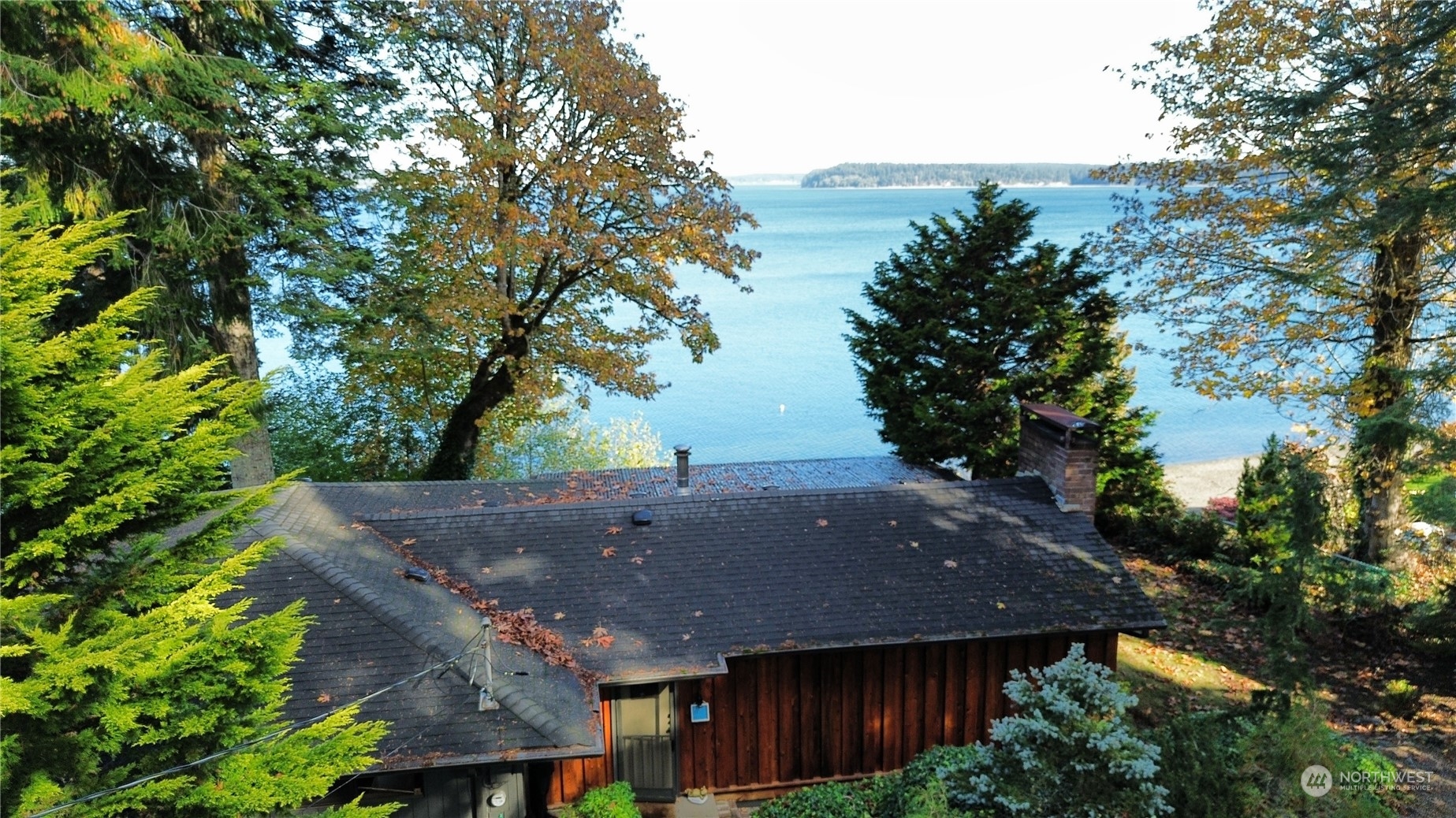 an aerial view of house with yard and seating space