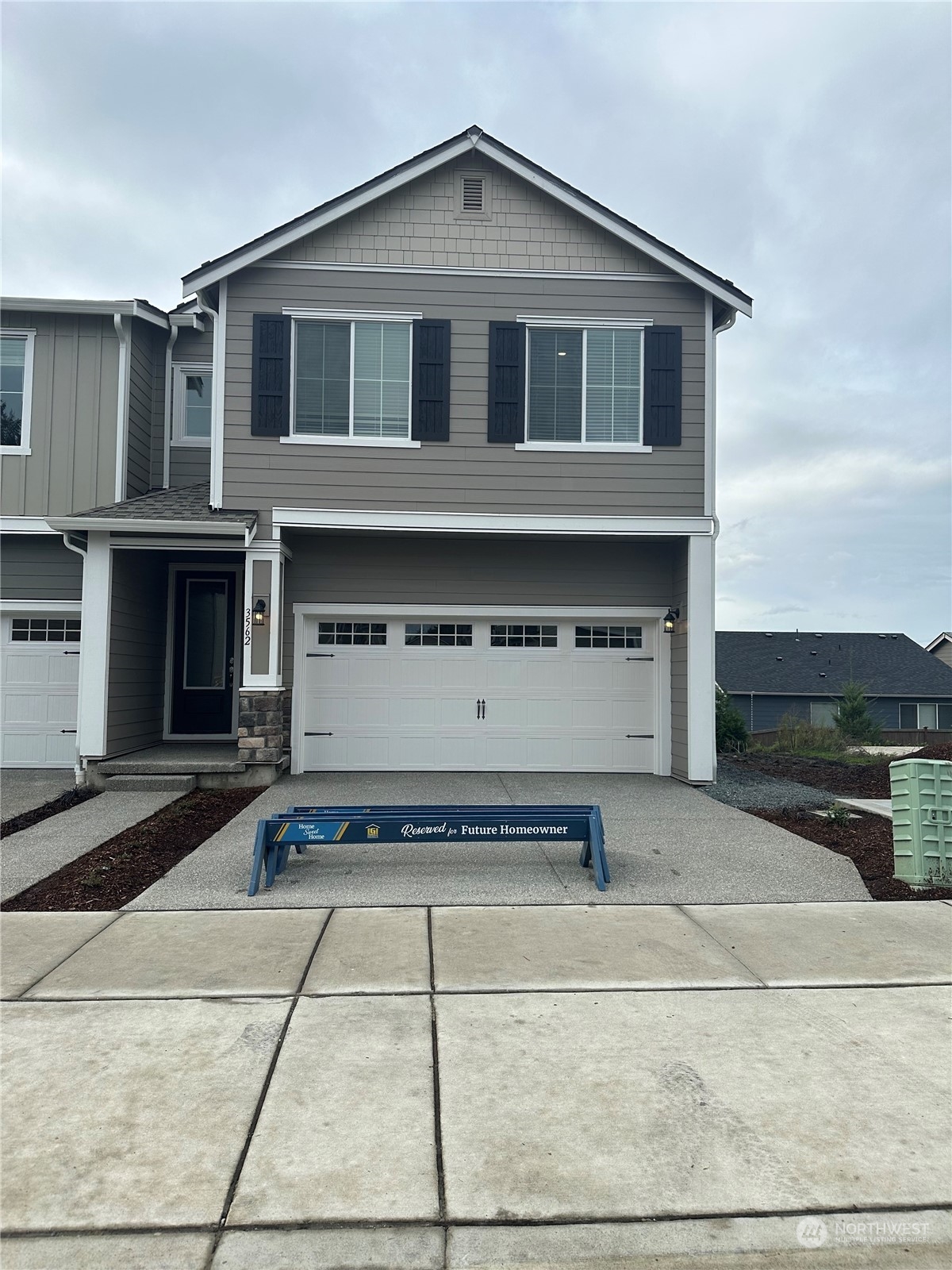 a front view of a house with a yard