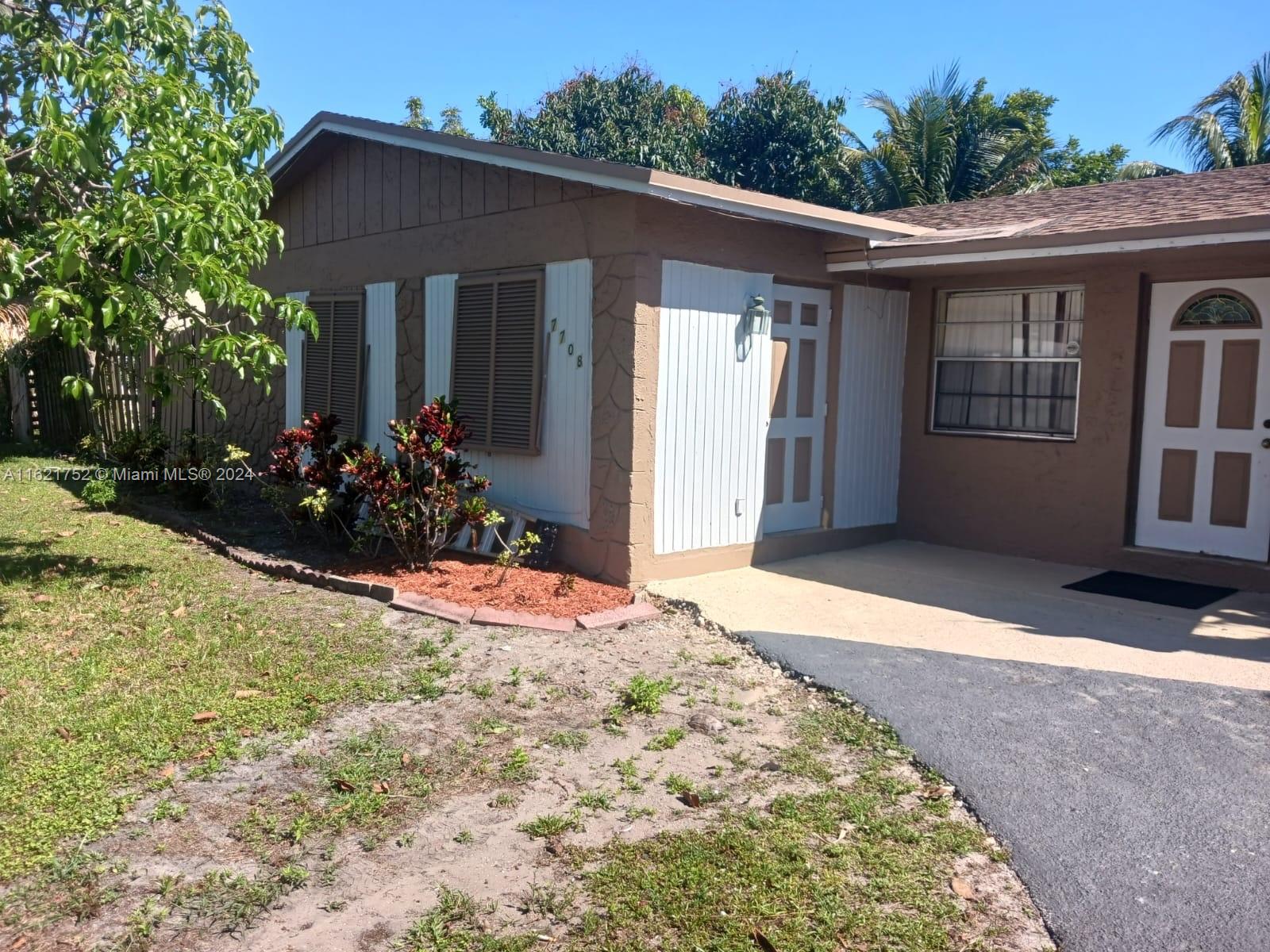 a front view of house with yard