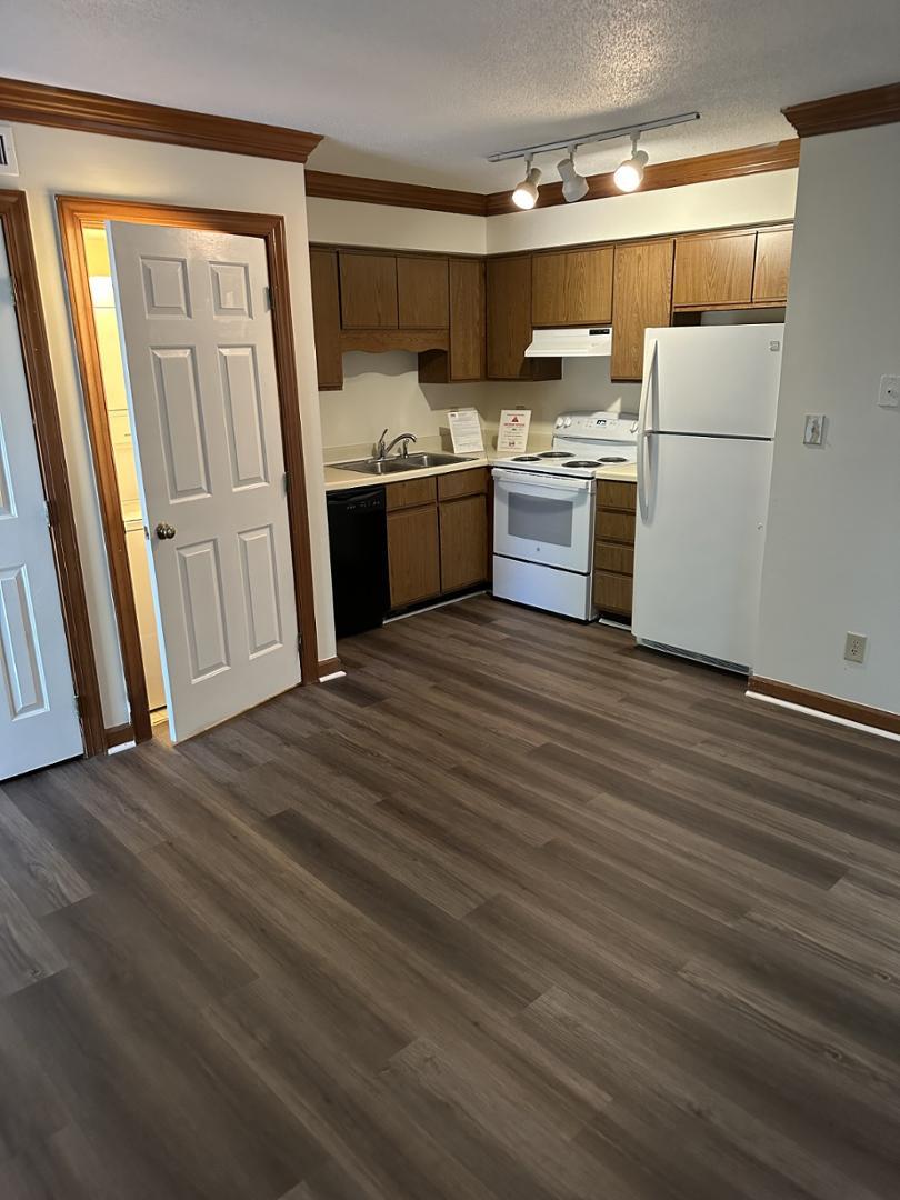 a kitchen with a sink and a stove top oven