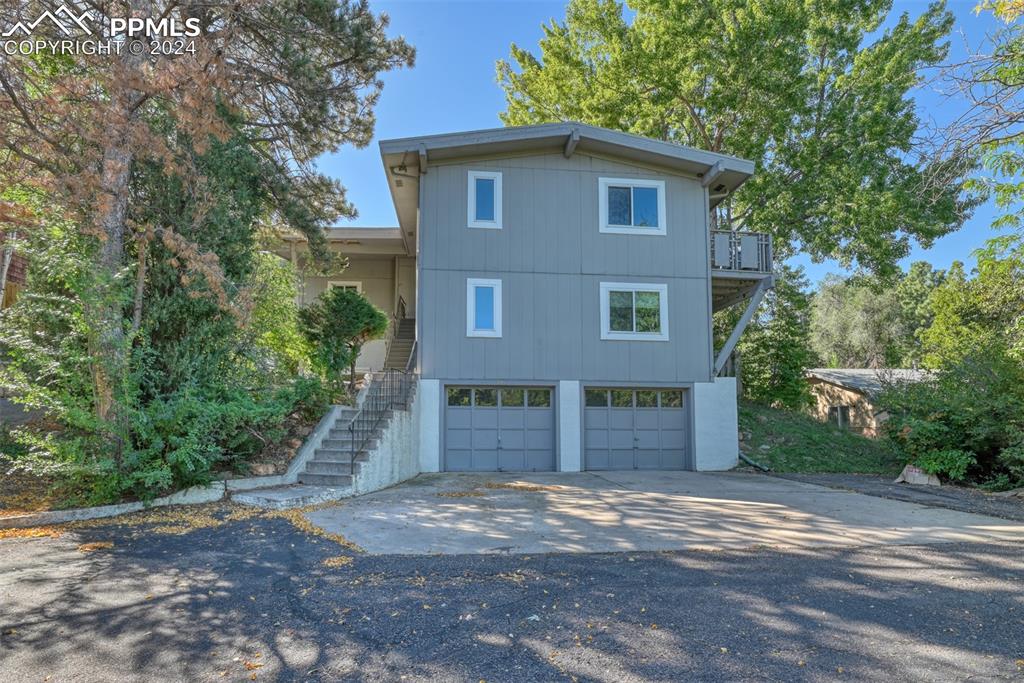 View of property exterior with a garage