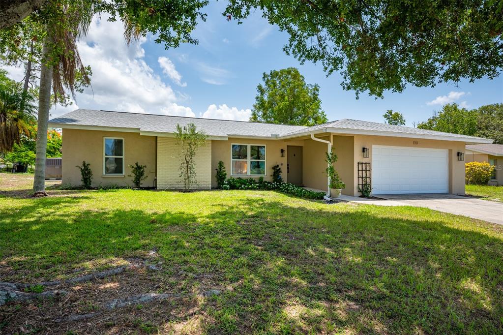 front view of a house with a yard