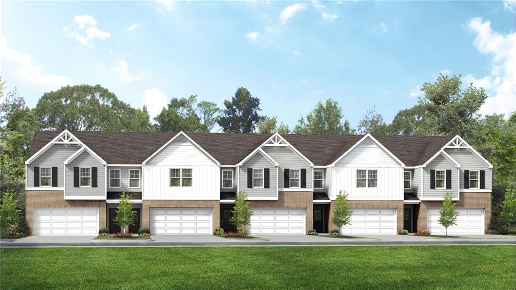 a view of house with yard and green space