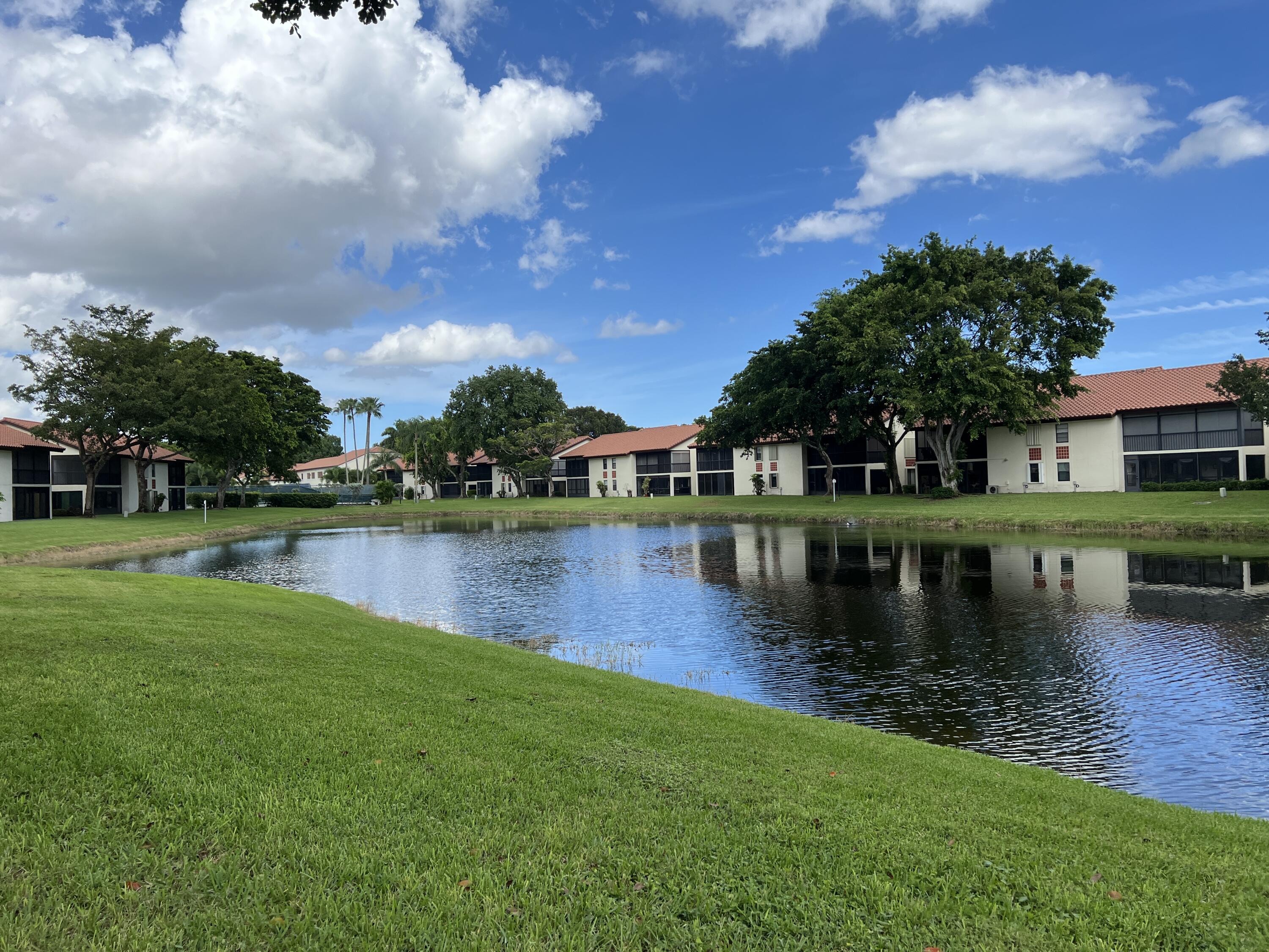 a view of a lake with a house in the background