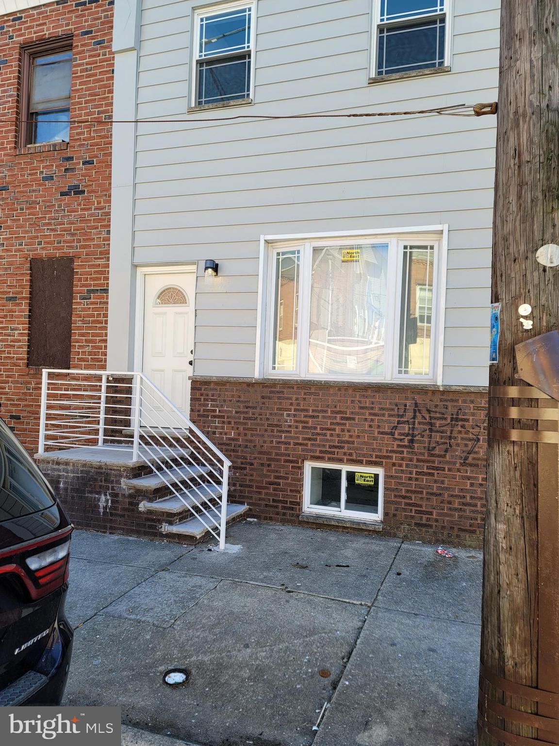 a front view of a house with stairs