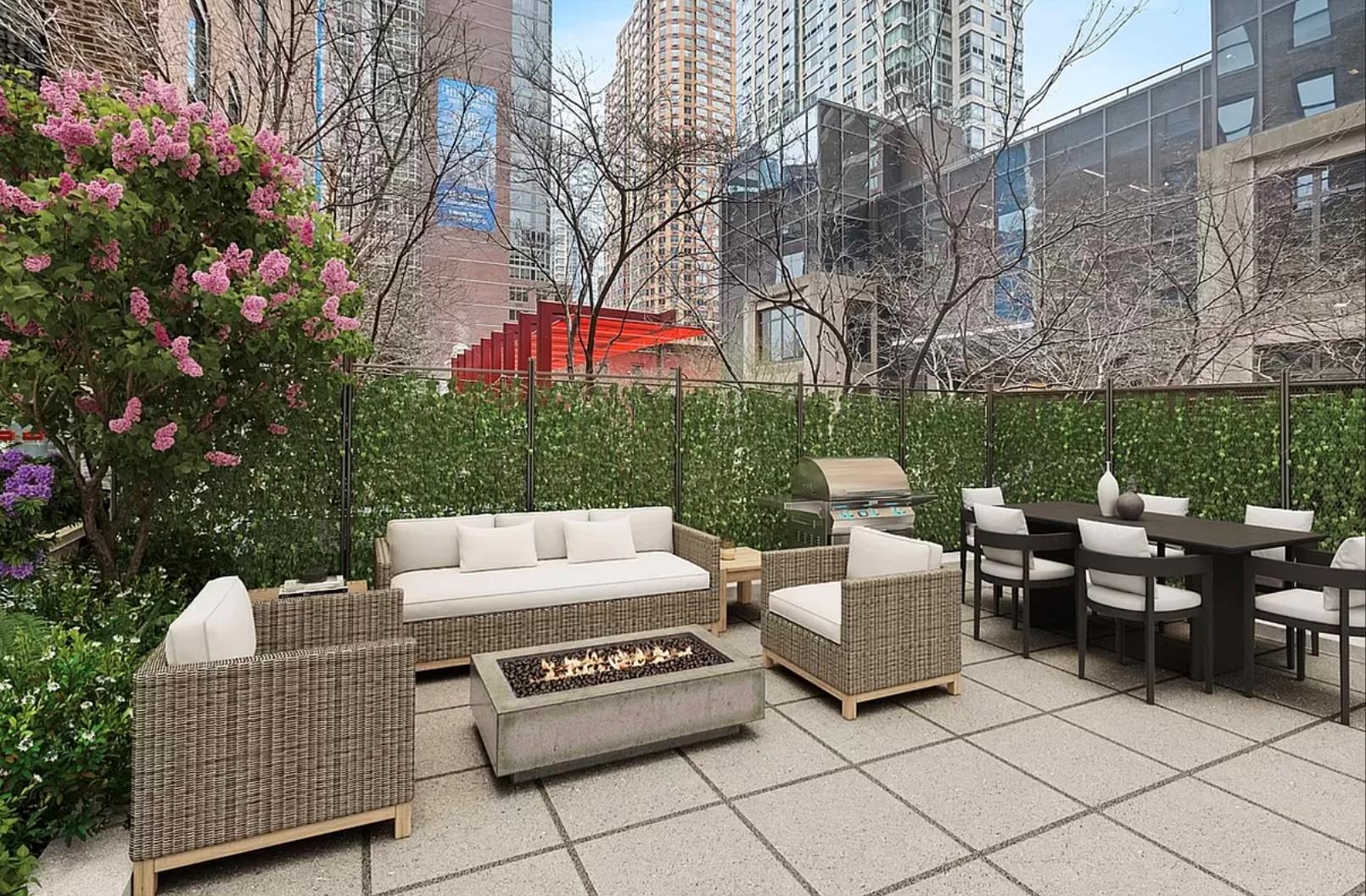 a view of a patio with couches and a table and chairs