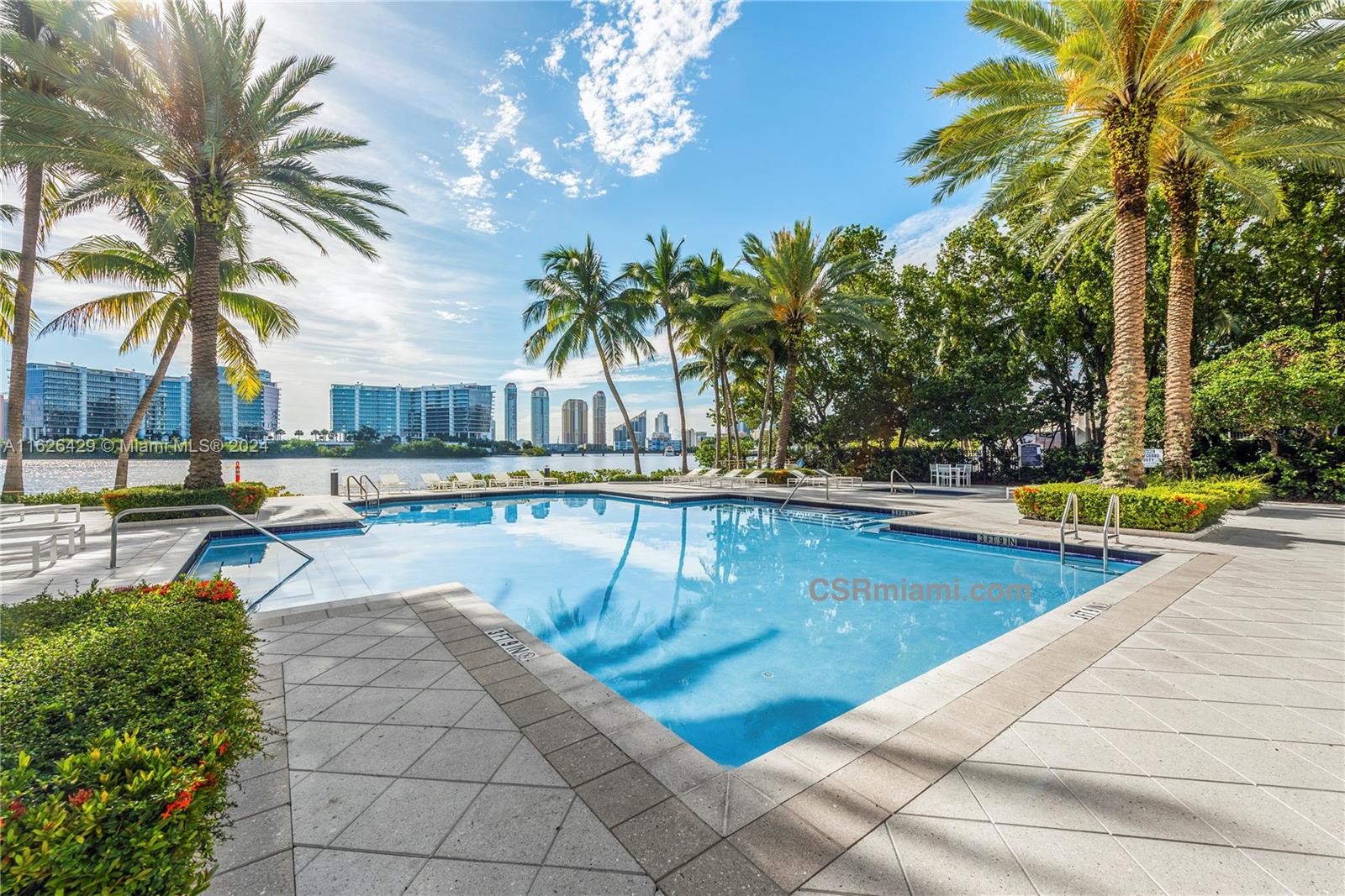 a view of swimming pool with chairs