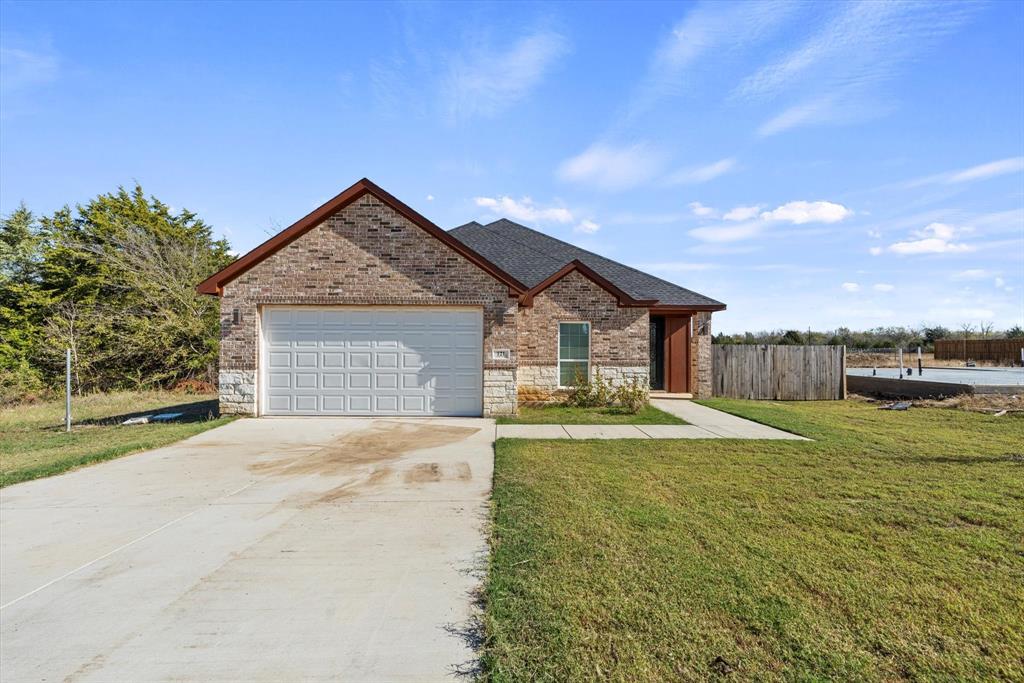 a front view of a house with yard