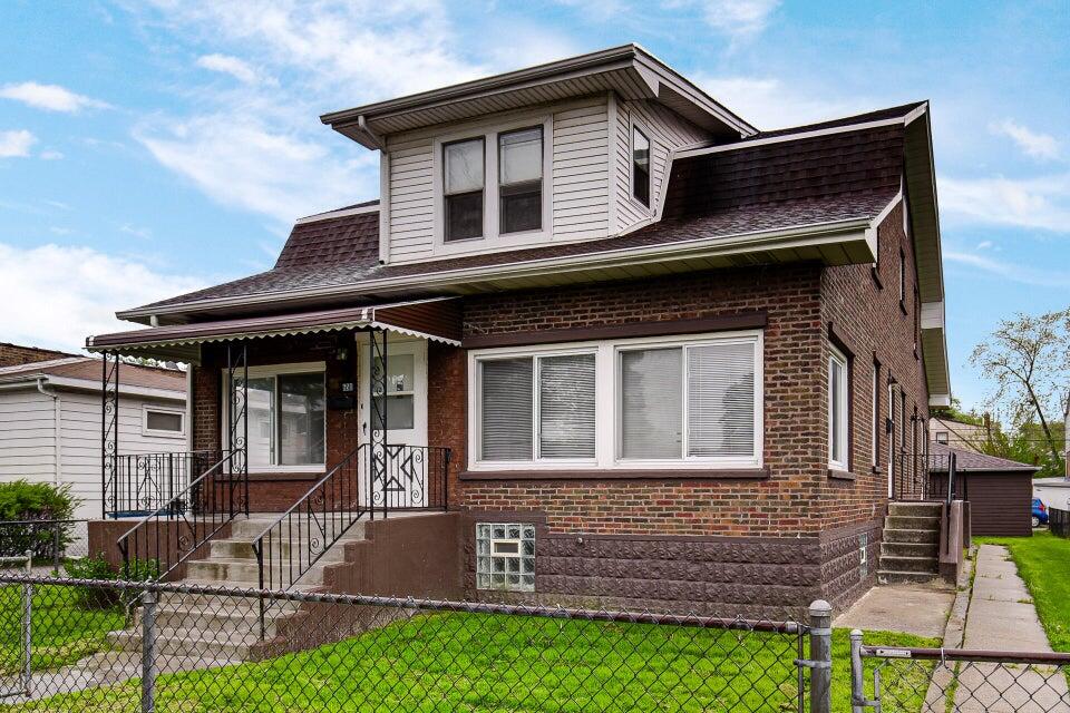 a front view of a house with garage