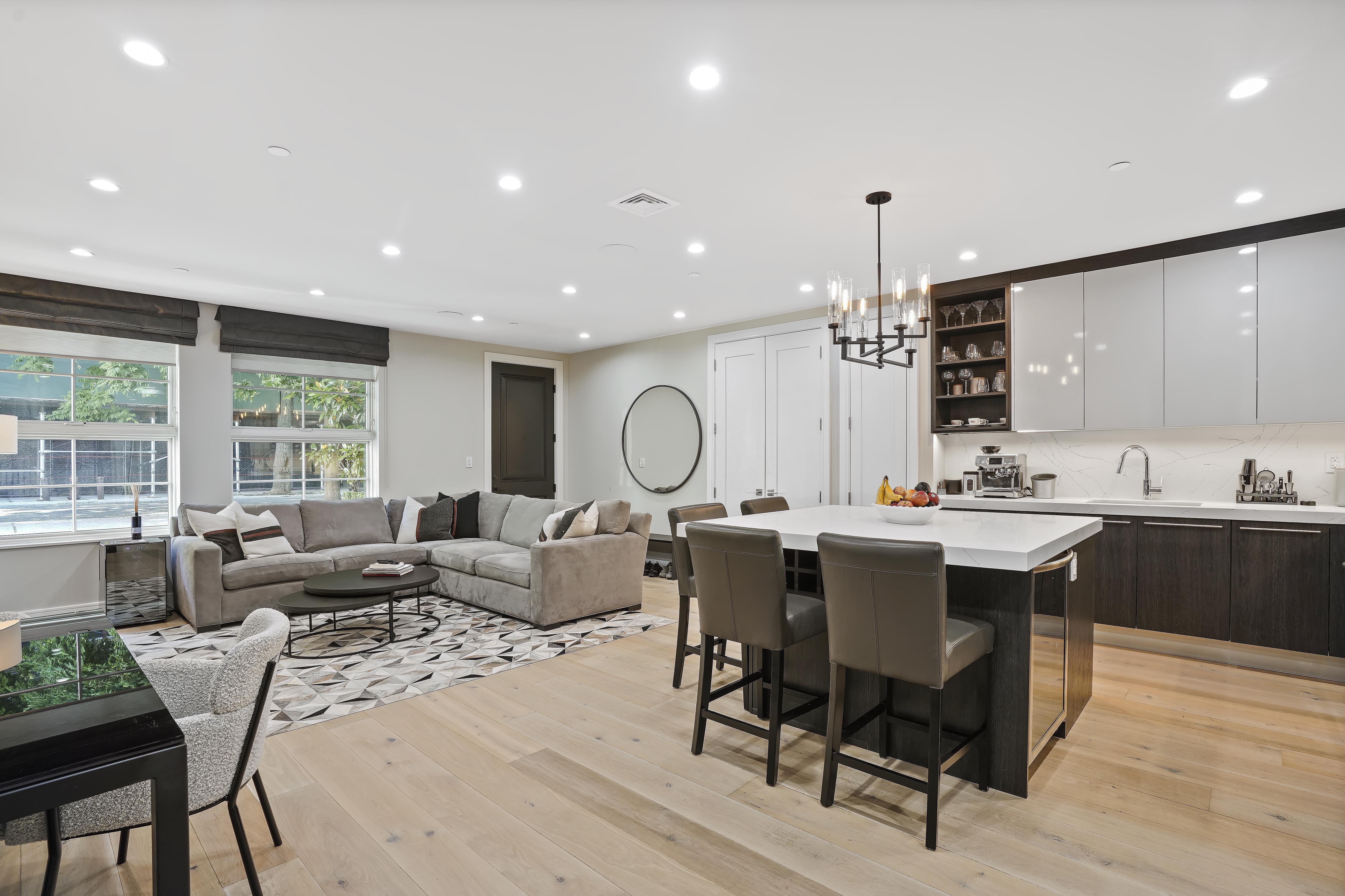 a living room with lots of furniture and a chandelier