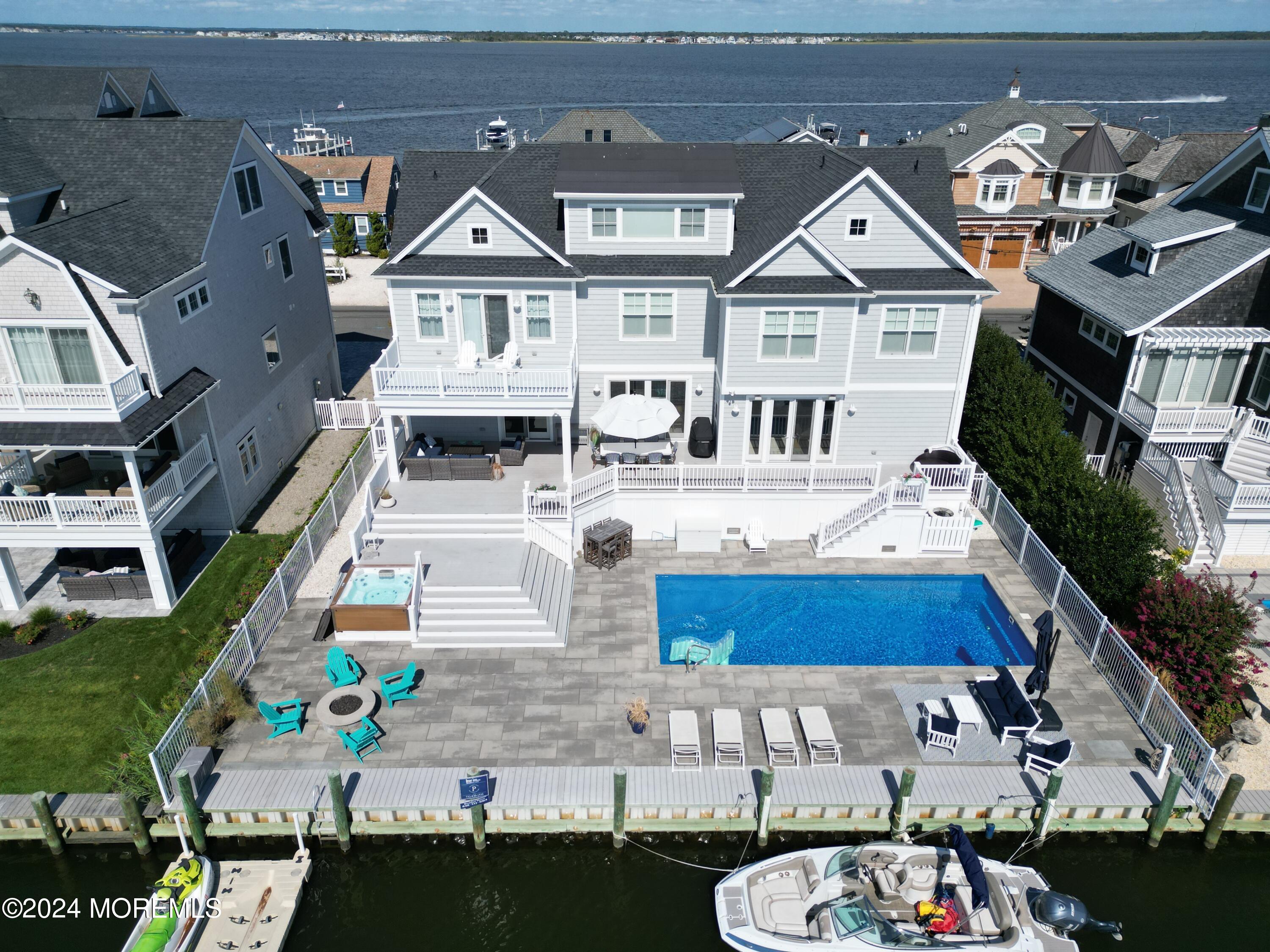 an aerial view of a house with wooden floor and city view