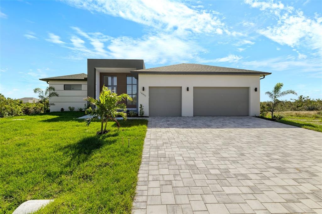 a front view of house with yard and green space