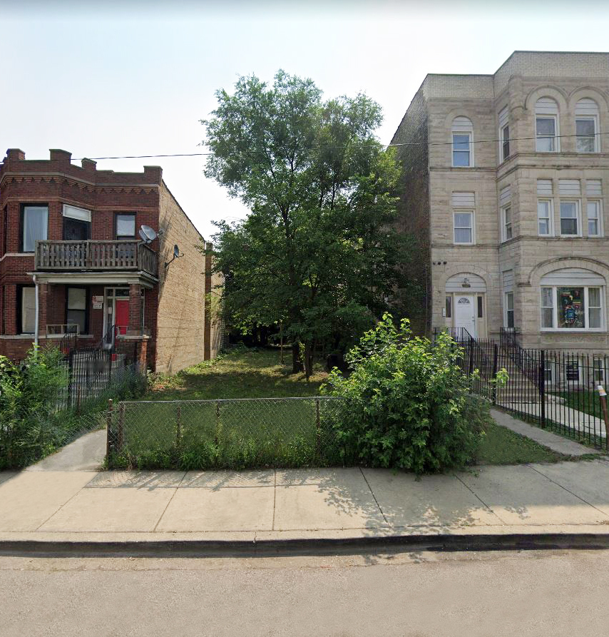 a front view of a house with a garden and plants