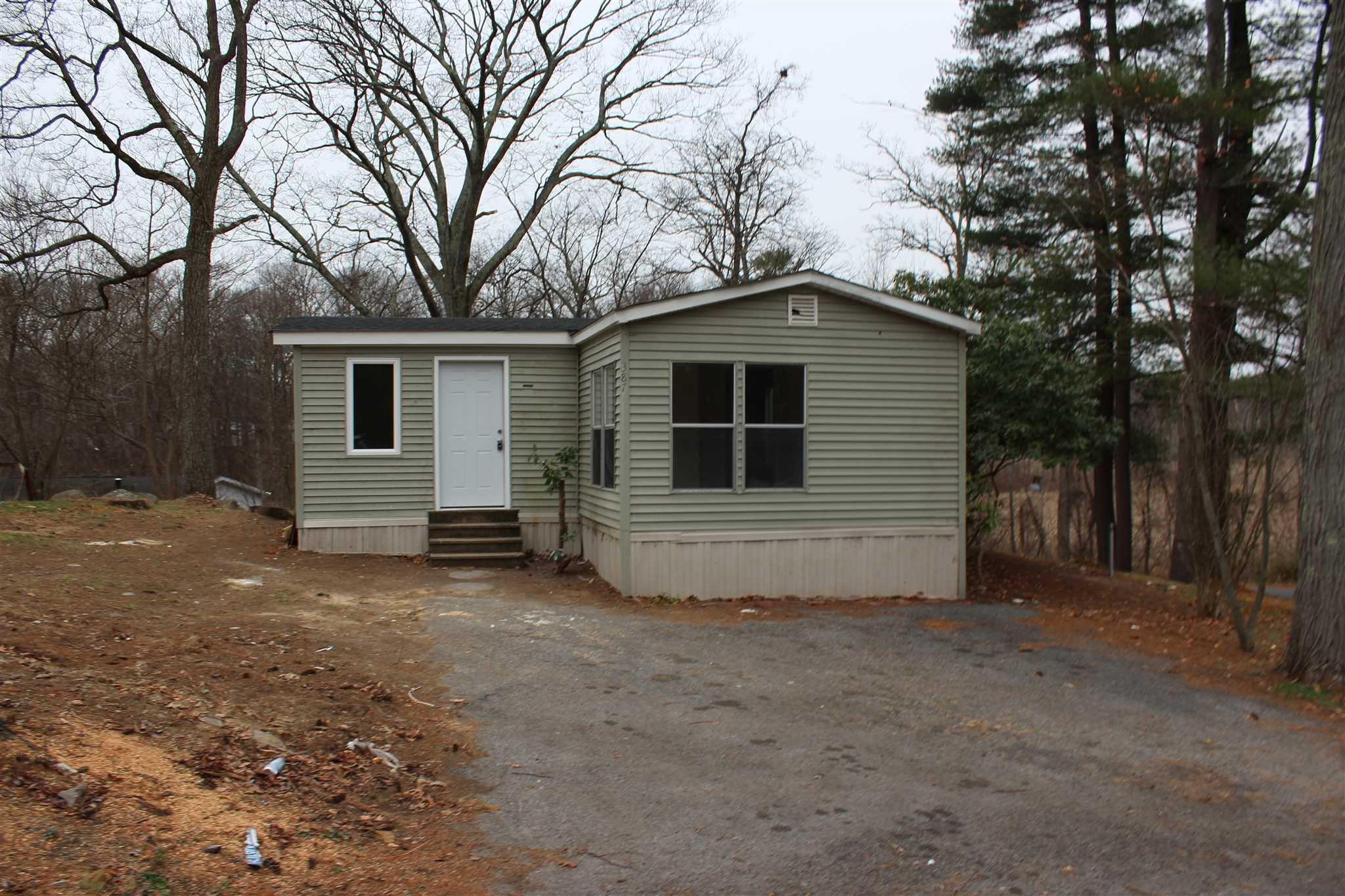 a house with trees in the background