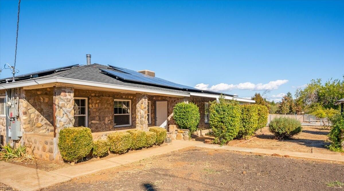 a front view of a house with a outdoor space