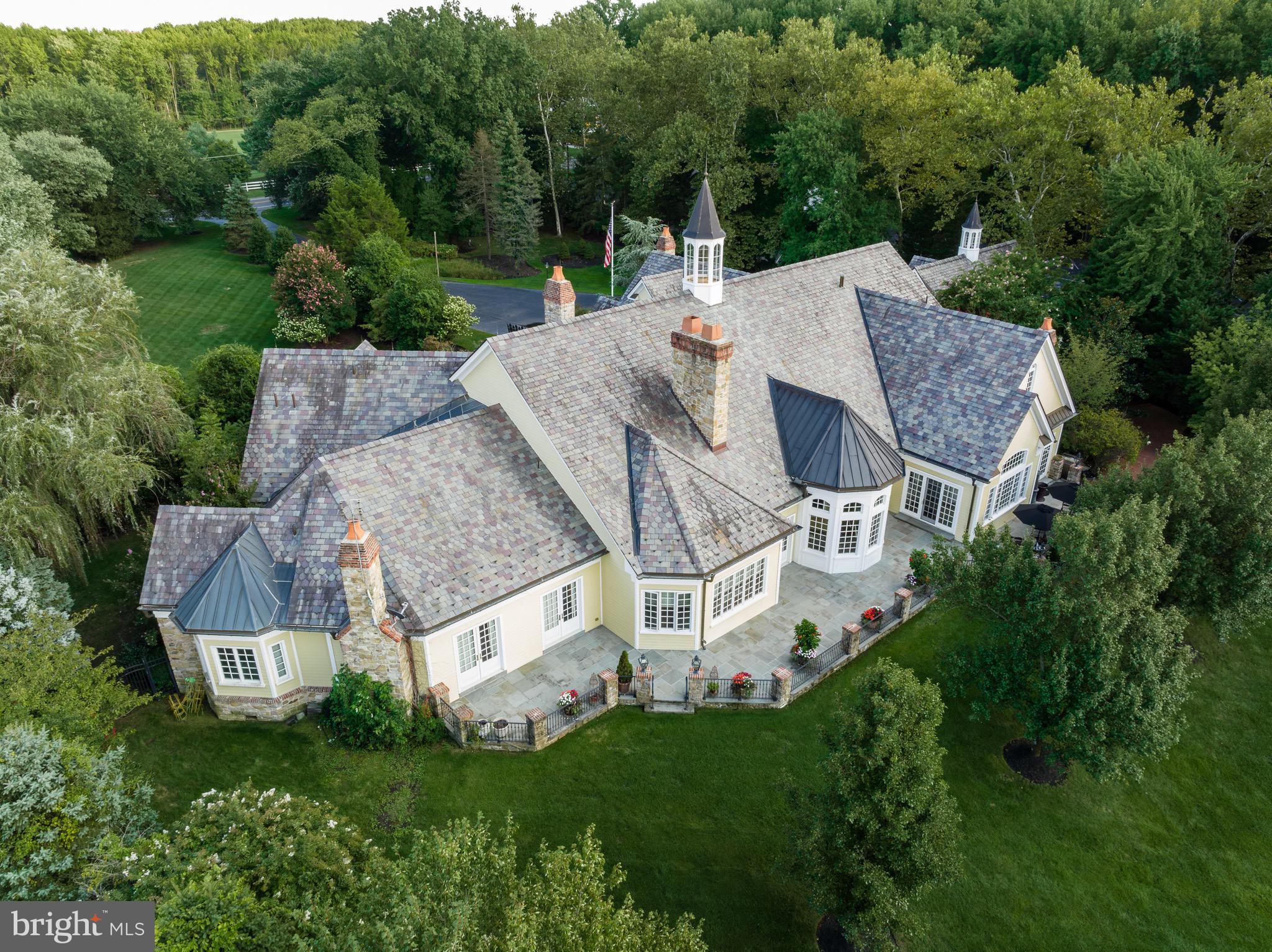 an aerial view of a house with a garden