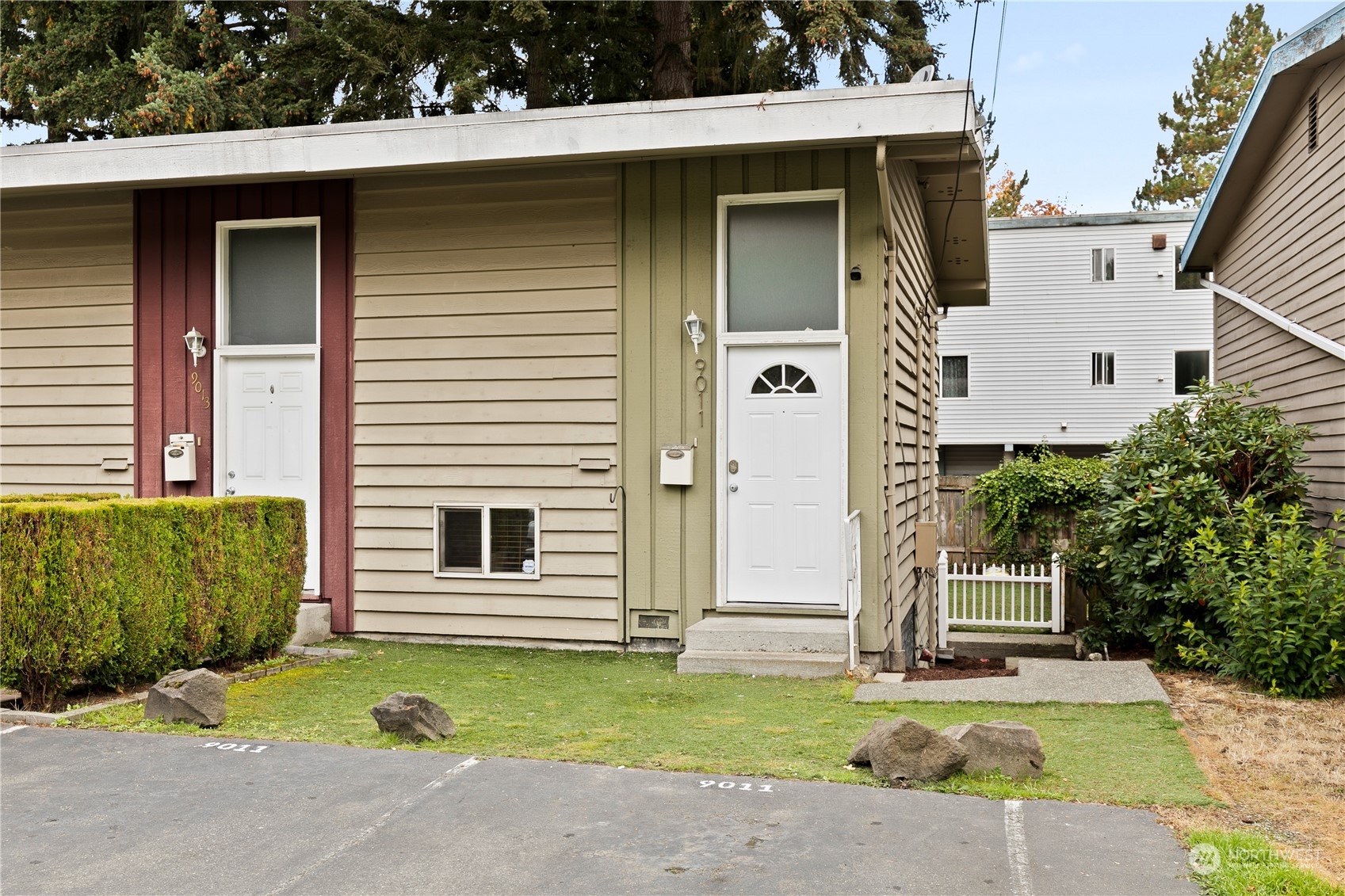 a front view of a house with a yard