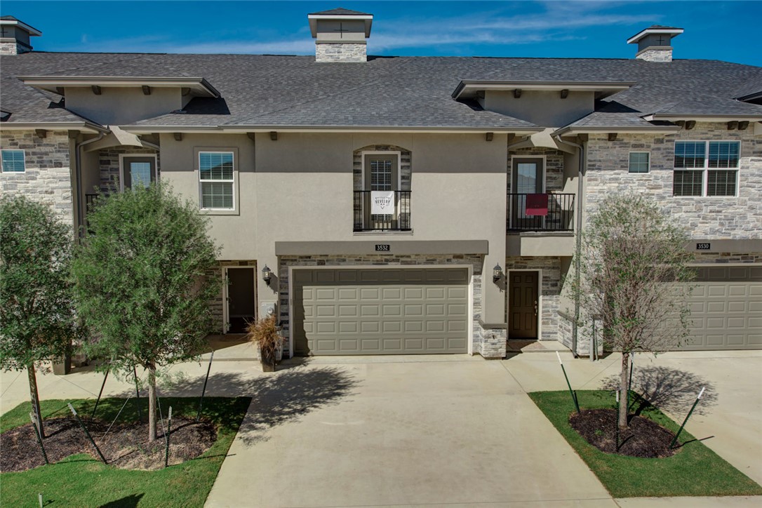 View of property featuring a garage