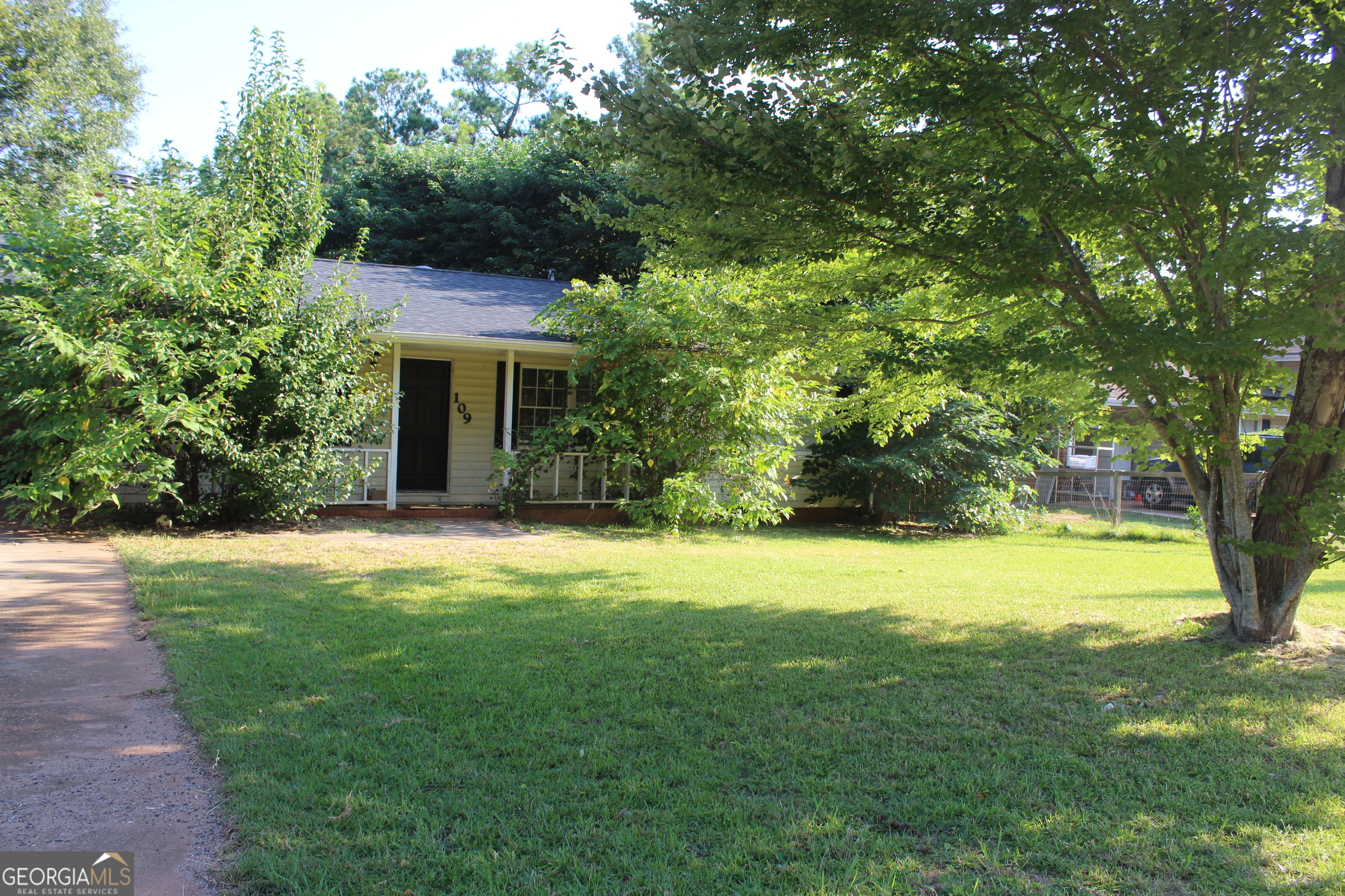 a view of a backyard with a garden