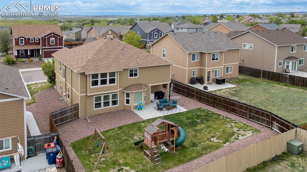 an aerial view of a house with swimming pool