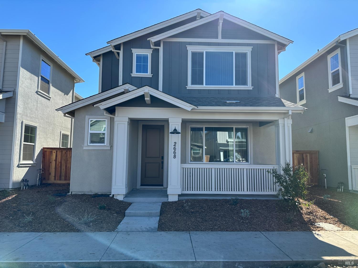 a front view of a house with yard