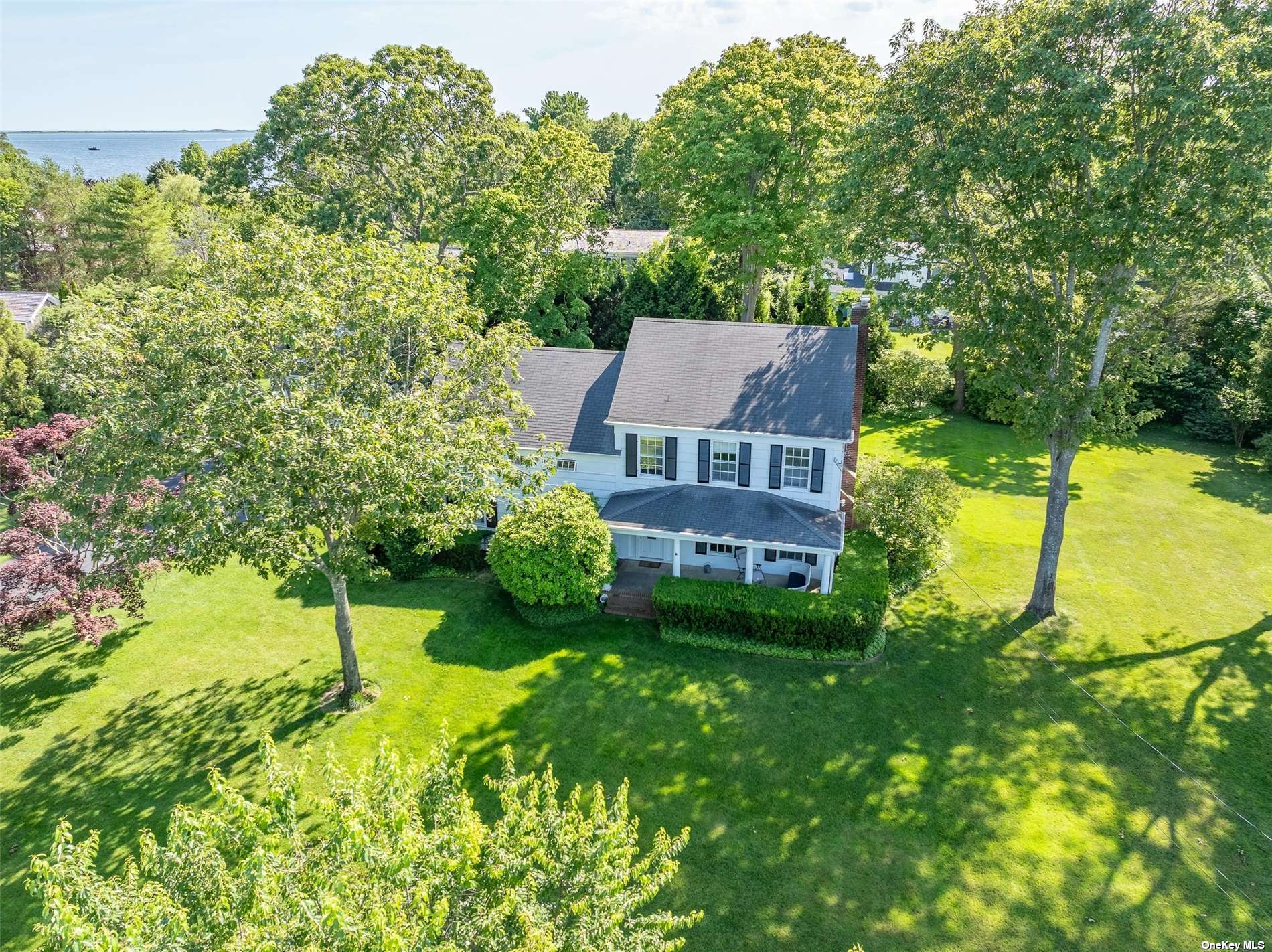 an aerial view of residential houses with yard and swimming pool