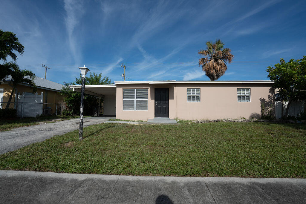 front view of a house with a yard