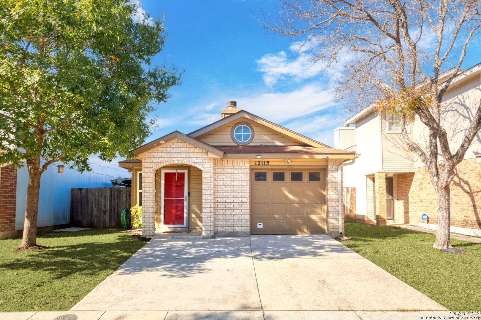 a front view of a house with yard