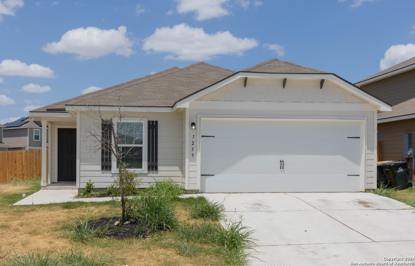 front view of a house with a yard