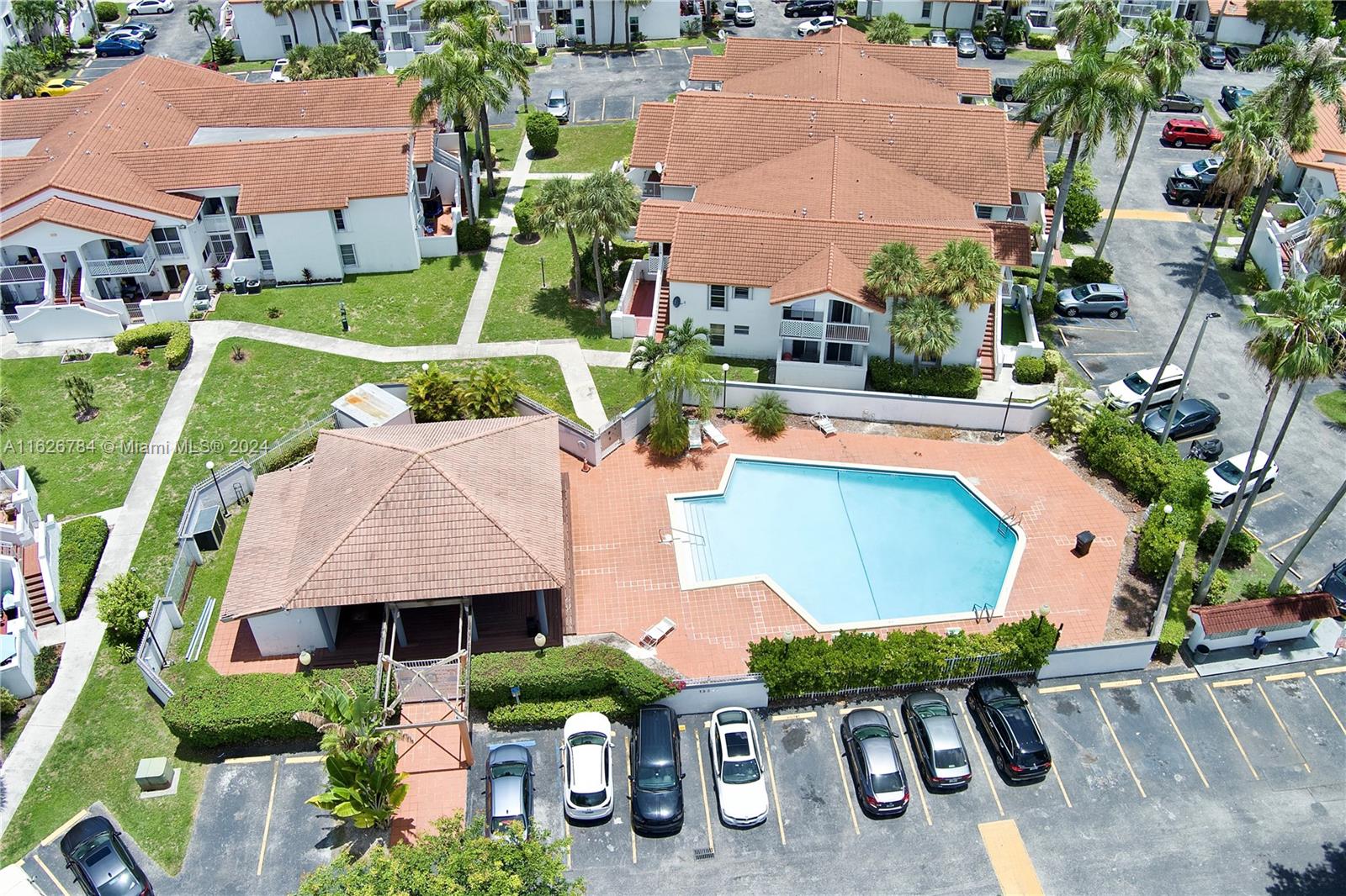 an aerial view of house with yard swimming pool and outdoor seating