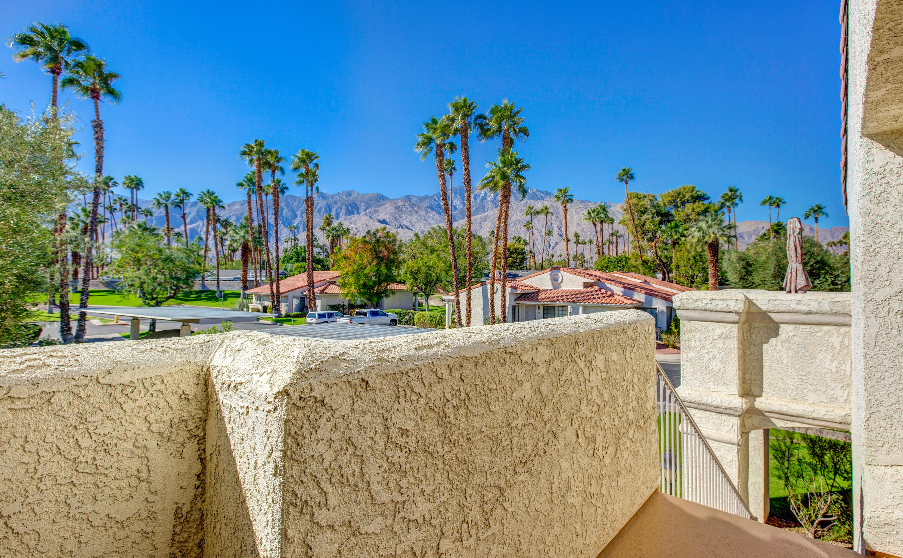 a view of a swimming pool with an outdoor seating