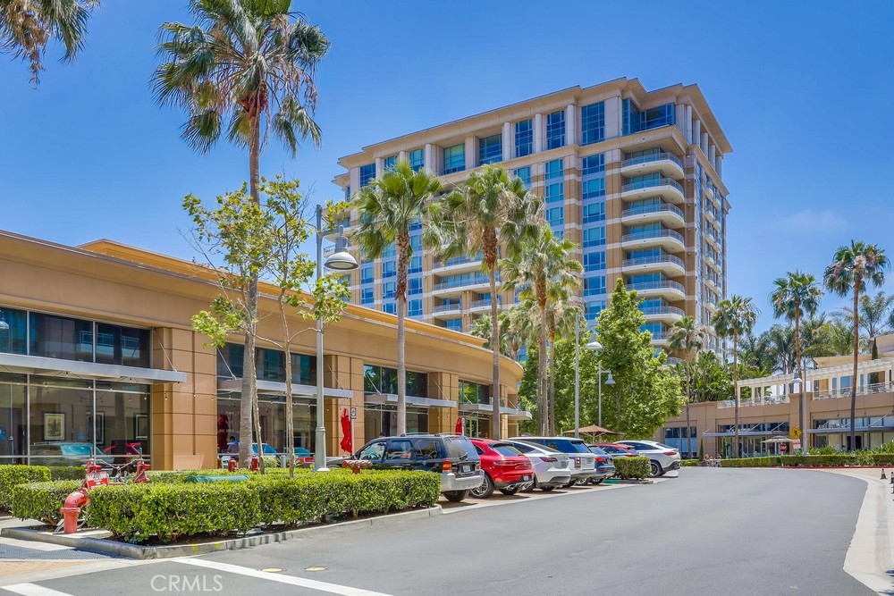 a front view of building with cars parked