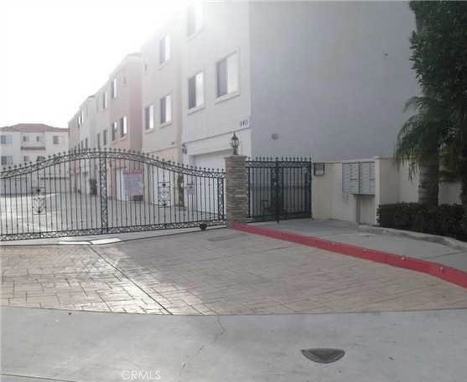 a view of a street with a building in the background